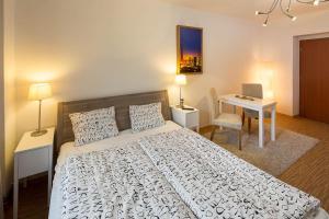 Postel nebo postele na pokoji v ubytování Apartmány Pod náměstím