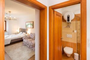 Postel nebo postele na pokoji v ubytování Apartmány Pod náměstím