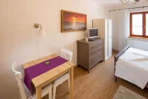 Postel nebo postele na pokoji v ubytování Apartmány Pod náměstím