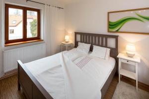 Postel nebo postele na pokoji v ubytování Apartmány Pod náměstím