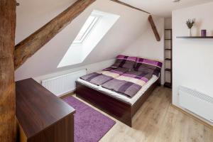 Postel nebo postele na pokoji v ubytování Apartmány Pod náměstím