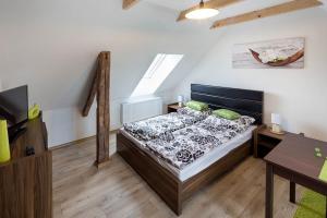 Postel nebo postele na pokoji v ubytování Apartmány Pod náměstím