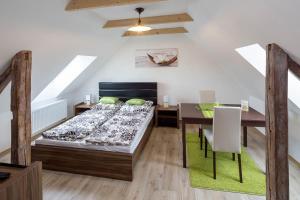 Postel nebo postele na pokoji v ubytování Apartmány Pod náměstím