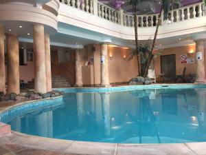 a large swimming pool in a hotel lobby at White Hart Hotel in Lewes