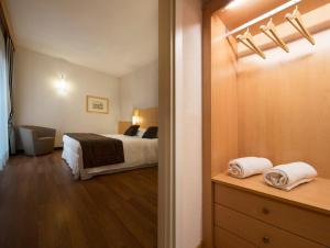 Postel nebo postele na pokoji v ubytování Hotel Rafael