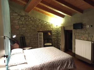 A bed or beds in a room at Agriturismo Spizzirò