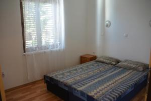 Postel nebo postele na pokoji v ubytování Vila Familia