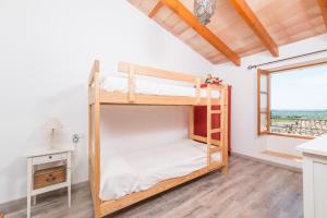 Postel nebo postele na pokoji v ubytování Sa Casa De Ses Bicicletes