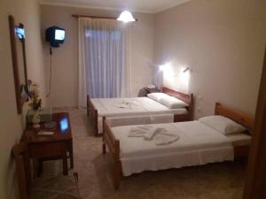 Postel nebo postele na pokoji v ubytování Santas Rooms
