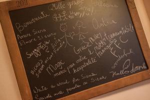 a chalkboard with some writing on it at B&B Il Senesino in Siena