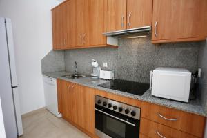 Kuchyňa alebo kuchynka v ubytovaní Apartaments Claudia