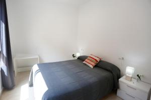 Posteľ alebo postele v izbe v ubytovaní Apartaments Claudia
