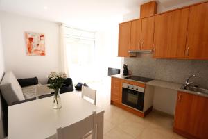 Kuchyňa alebo kuchynka v ubytovaní Apartaments Claudia