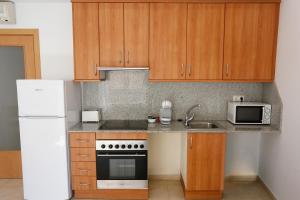 Kuchyňa alebo kuchynka v ubytovaní Apartaments Claudia