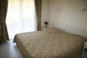 a bedroom with a bed and a window at Life Apart in Marmaris