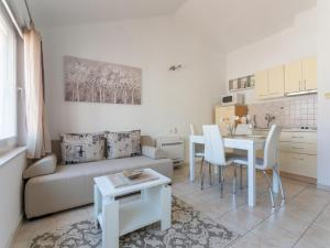 a living room with a couch and a table at Apartments Tomy & Domy in Dubrovnik