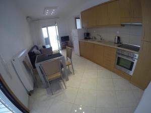 Kuchyňa alebo kuchynka v ubytovaní Dimi Apartments