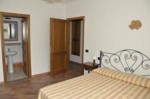 Postel nebo postele na pokoji v ubytování Agriturismo Renai e Monte II