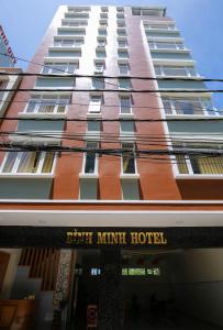 a tall building with a sign for a hotel at Binh Minh Hotel in Vung Tau