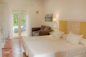Säng eller sängar i ett rum på Hotel Malaga Picasso