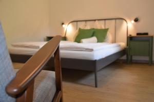 Postel nebo postele na pokoji v ubytování GRÜNER HEINRICH - Bett&Frühstück