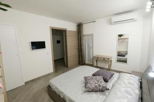 Un pat sau paturi într-o cameră la Affittacamere San Lorenzo