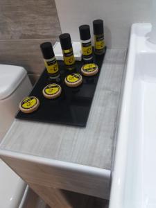 a table with four bottles of oil on it at Villa Riviera in Stavros