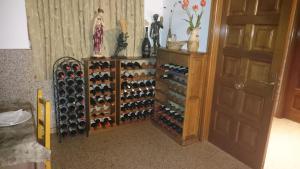 a room with a bunch of wine bottles at Bahia de Chapela in Redondela