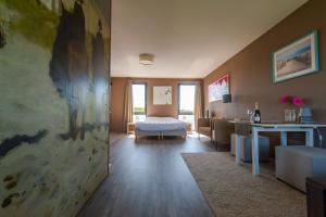 Postel nebo postele na pokoji v ubytování B&B Beach Inn
