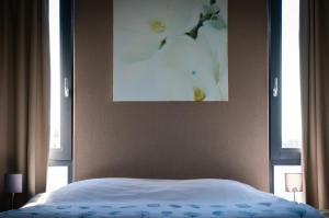Postel nebo postele na pokoji v ubytování B&B Beach Inn
