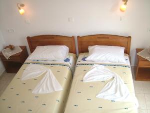 Ένα ή περισσότερα κρεβάτια σε δωμάτιο στο Ξενοδοχείο Estelle