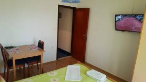 TV a/nebo společenská místnost v ubytování Apartments Alissa