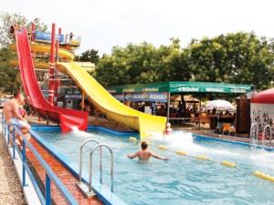 a child in a swimming pool at a water park at Apartment Stella in Murter