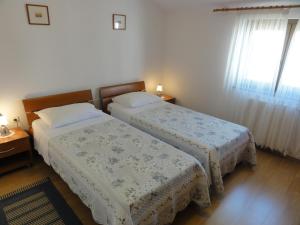 Postel nebo postele na pokoji v ubytování Apartment Marcella