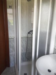 a bathroom with a shower and a sink at Casa Artemia in Sanxenxo +17 photos
