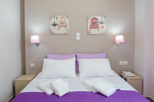 Ένα ή περισσότερα κρεβάτια σε δωμάτιο στο LUX Hotel