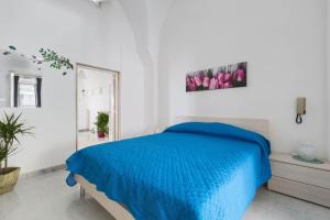 سرير أو أسرّة في غرفة في Casa Angiulina by BarbarHouse