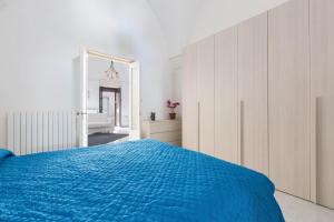 سرير أو أسرّة في غرفة في Casa Angiulina by BarbarHouse