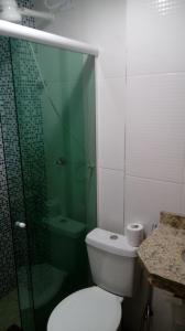 a bathroom with a toilet and a glass shower at Hostel Pontal do Duque in Rio de Janeiro +31 photos