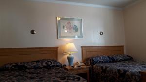 Cama o camas de una habitación en The Maplewood Motel