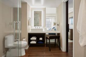 
a bathroom with a sink, toilet, and bathtub at Hotel Nikko San Francisco in San Francisco
