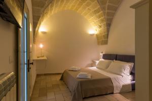 A bed or beds in a room at B&B Donnantonietta - Nobile dimora