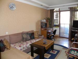 A seating area at Comfortable apartment in Batumi