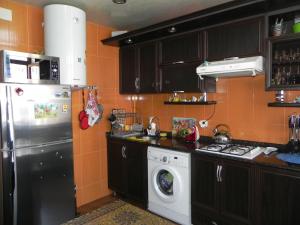A kitchen or kitchenette at Comfortable apartment in Batumi