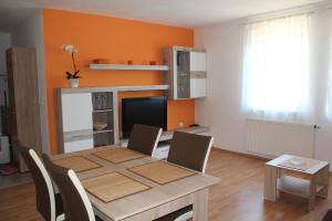 a dining room with a table with chairs and a dining room at Alpes in Radovljica