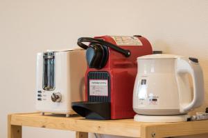 a counter with a coffee maker and a mixer on it at Kiseki in Niseko