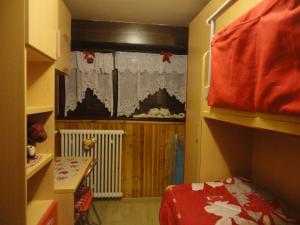 A bed or beds in a room at Sella Ronda Apartment