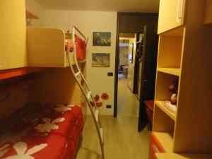 A bed or beds in a room at Sella Ronda Apartment