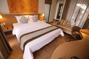 Postel nebo postele na pokoji v ubytování Liberta Hotel Jimbaran