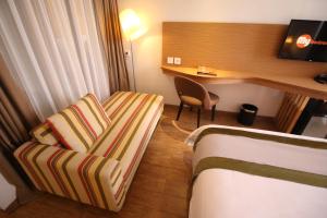 TV a/nebo společenská místnost v ubytování Liberta Hotel Jimbaran